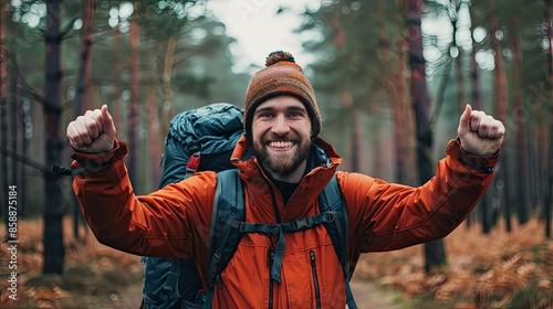 Cheerful adventurer with a backpack in Cannock Chase forest