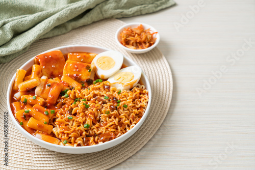 Korean instant noodles with Korean rice cake and fish cake and boiled egg photo