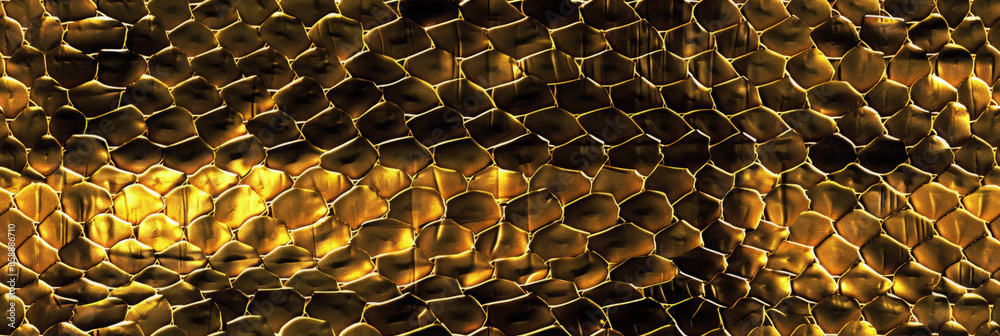 Close up of a gold snake skin background texture Close up of a gold snake skin background texture