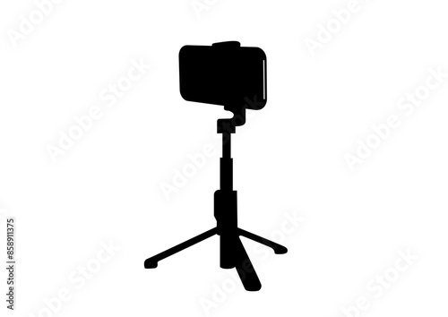 スマホで写真や動画を撮影するシルエット。小さな三脚にセットしたスマートフォン。