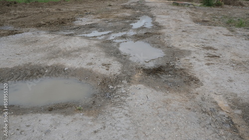 Ground after rain. Irregular space with puddles of swamp