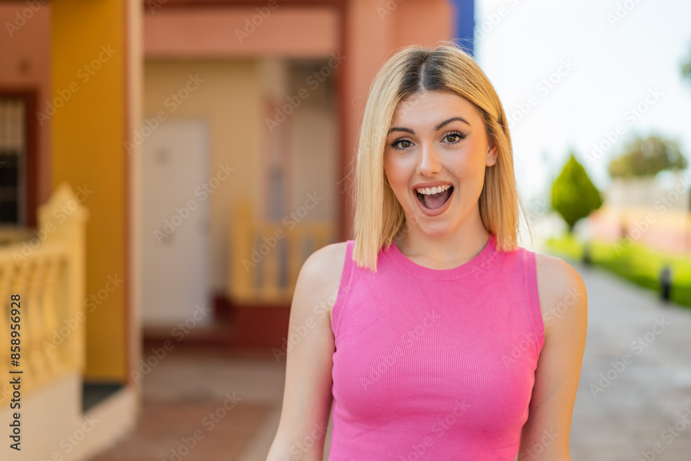 Fototapeta premium Young pretty blonde woman at outdoors with surprise facial expression