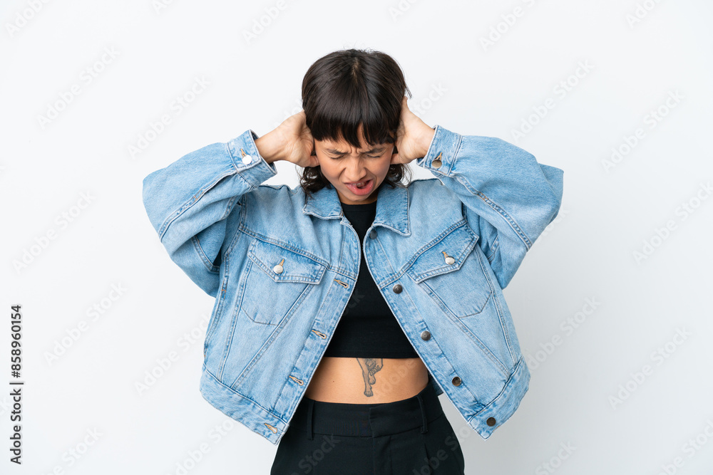 Young mixed race woman isolated on white background frustrated and covering ears Young mixed race woman isolated on white background frustrated and covering ears