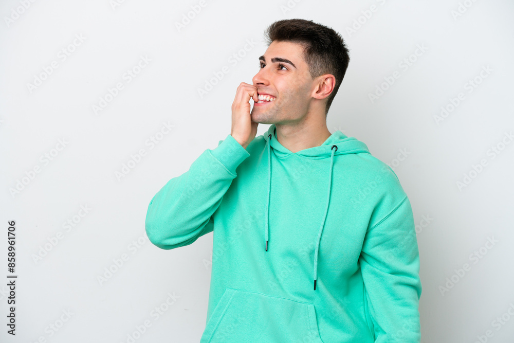 Young caucasian man isolated on white background is a little bit nervous Young caucasian man isolated on white background is a little bit nervous