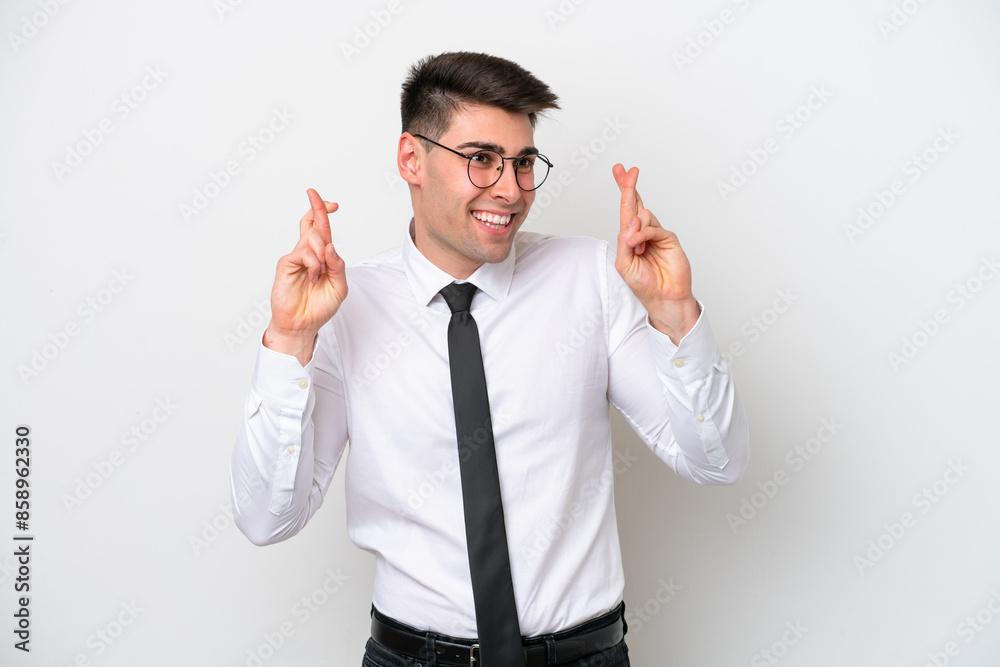 Business caucasian man isolated on white background with fingers crossing Business caucasian man isolated on white background with fingers crossing