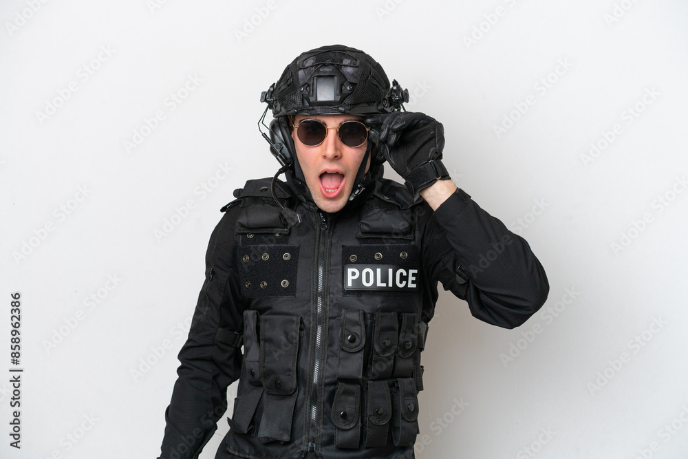 SWAT caucasian man isolated on white background with glasses and surprised SWAT caucasian man isolated on white background with glasses and surprised