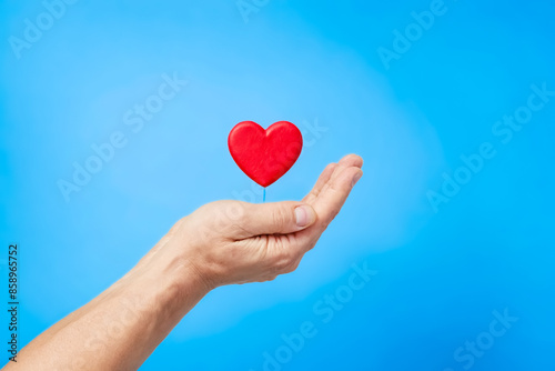 Hand Holding a Red Heart