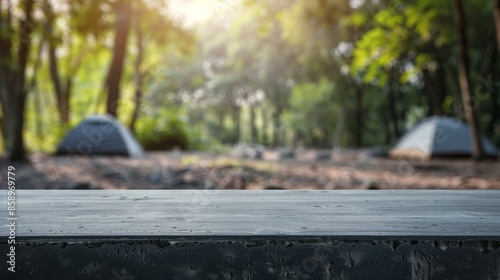 Dark Wooden Table Against a Blurry Forest Backdrop