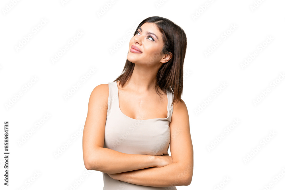 Young Russian woman over isolated chroma key background looking up while smiling Young Russian woman over isolated chroma key background looking up while smiling