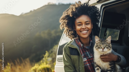 Serene Connection - African-American Woman Hugging Cat at Mountain Overlook with Campervan in Morning Light photo