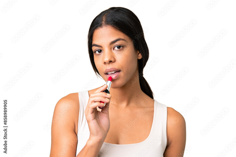Young woman over over isolated chroma key background holding red lipstick Young woman over over isolated chroma key background holding red lipstick