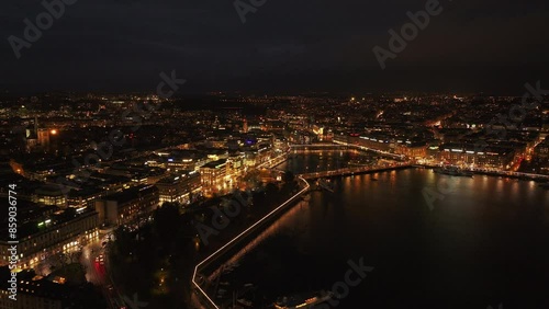 Wallpaper Mural Aerial view of Geneva's lit skyline and waterfront at night, capturing Jardins des Anglais and traffic over Pont du Mont Blanc Torontodigital.ca