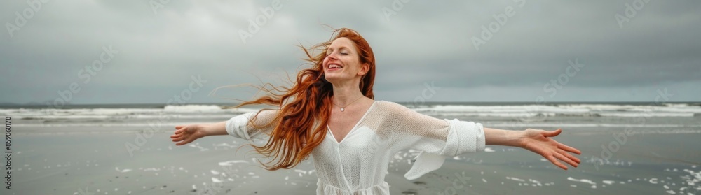 Beautiful woman with red hair rejoices on the beach Beautiful woman with red hair rejoices on the beach