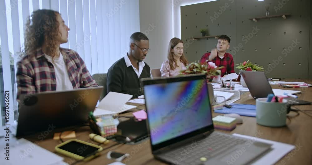 Mixed race business professionals in a meeting discussing strategies and brainstorming ideas for success. Mixed race business professionals in a meeting discussing strategies and brainstorming ideas for success.