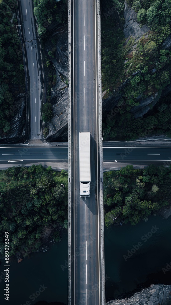 Aerial Photography of White Cargo Truck on Bridge: Modern Logistics in Motion Aerial Photography of White Cargo Truck on Bridge: Modern Logistics in Motion