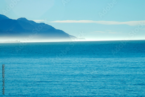 Strolling on the beach under the winter sun in New Zealand