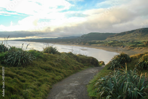 Strolling on the beach under the winter sun in New Zealand