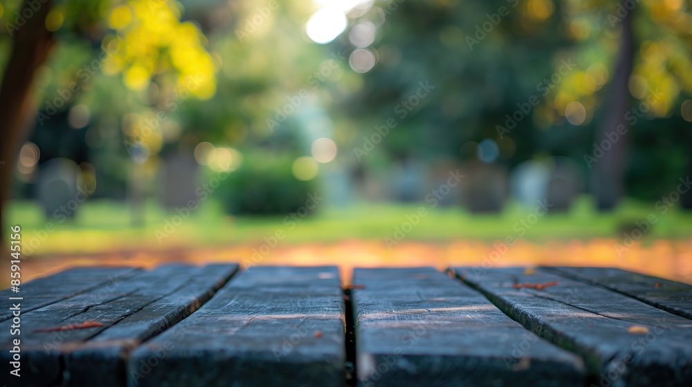a close up of a empty wooden table with graveyard background a close up of a empty wooden table with graveyard background