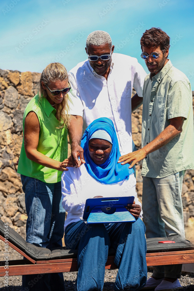 Multiracial team collaborates on business project outdoors Multiracial team collaborates on business project outdoors