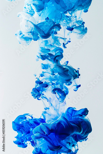 Abstract blue and white ink swirling in water, creating intricate and mesmerizing patterns against a light background, capturing the fluidity and dynamic motion of the colors.