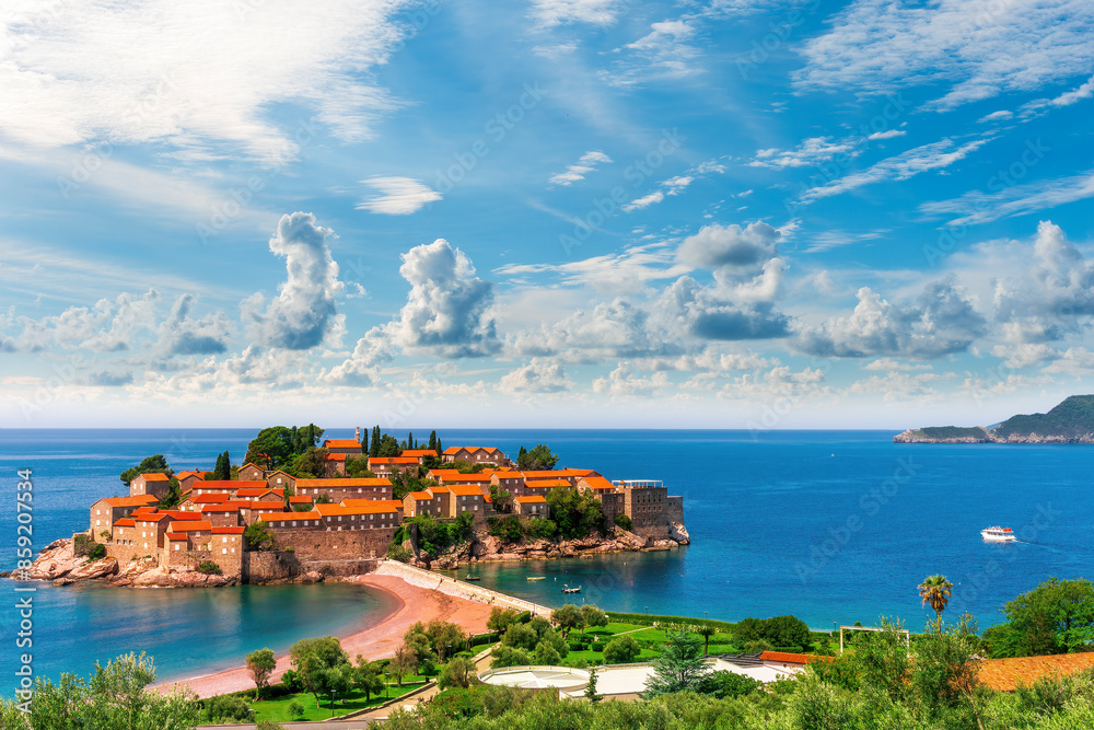Fototapeta premium beautiful summer landscape of amazing resort on amazing island with yellow ancient walls and orange tile roofs among sea vawes and nice blue sky on background