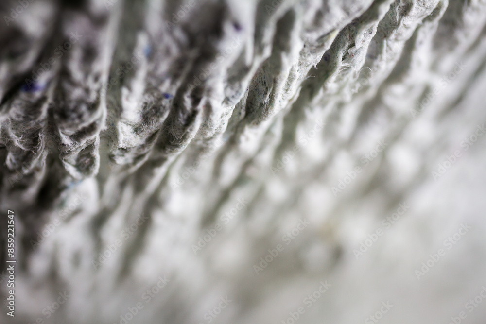 Extreme close up of old gray handmade paper mache with a structure and rough texture. Extreme close up of old gray handmade paper mache with a structure and rough texture.