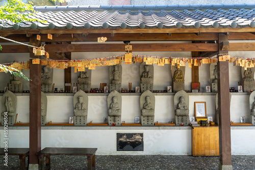 This photo series captures intricate close-up views of religious objects found in traditional temples. Featuring sacred artifacts such as incense burners, deity statues, prayer plaques, ritual impleme