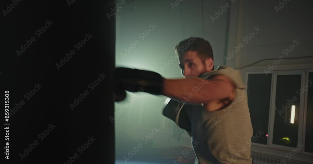 Shirtless Man Holding Black Boxing Glove Shirtless Man Holding Black Boxing Glove
