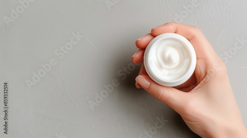 Glowing skincare cream being applied to smooth skin, skincare, rejuvenation photo