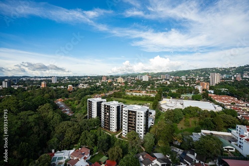 wide capture of guatemala city showing many buildings, apartments, hotels, parks, and mountains