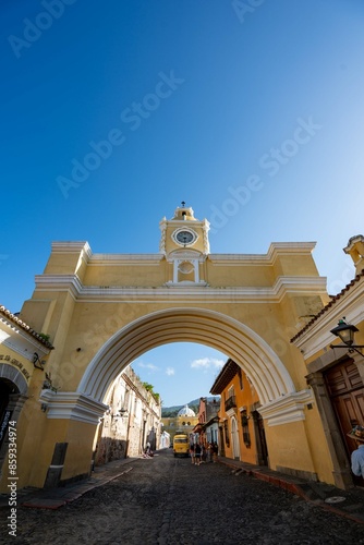 epic large yellow gate in city center of colonial city with antique architecture