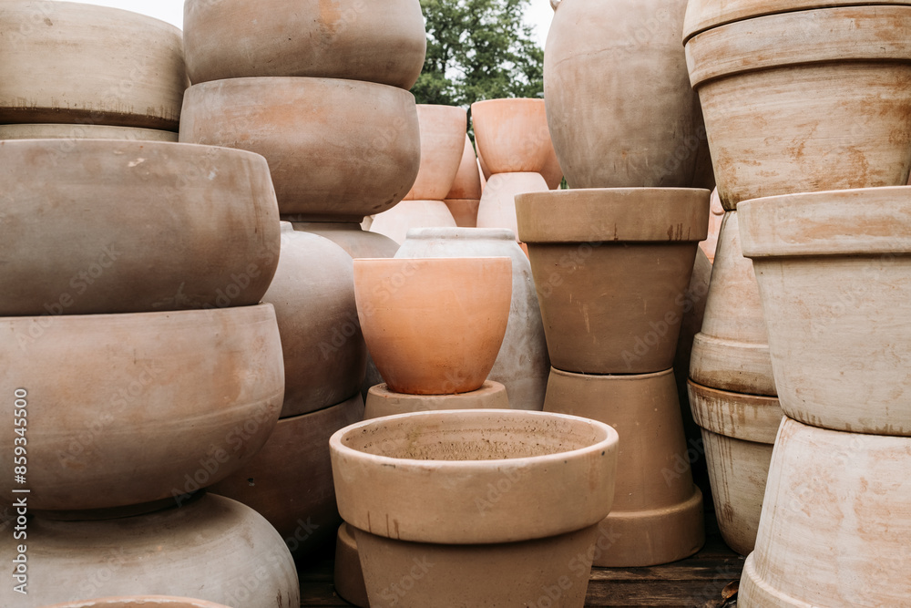 Ceramic terracotta flower pots in different sizes and shapes for sale at the garden center Ceramic terracotta flower pots in different sizes and shapes for sale at the garden center