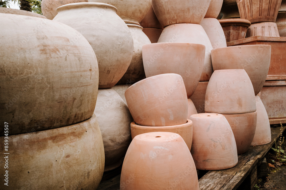 Ceramic terracotta flower pots in different sizes and shapes for sale at the garden center Ceramic terracotta flower pots in different sizes and shapes for sale at the garden center