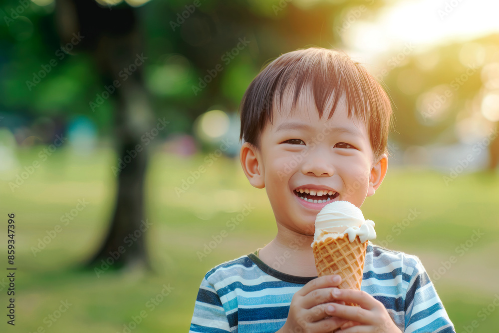 Happy smiling asian little boy holding delicious ice cream in the park. Summer vacation concept, summer time Happy smiling asian little boy holding delicious ice cream in the park. Summer vacation concept, summer time
