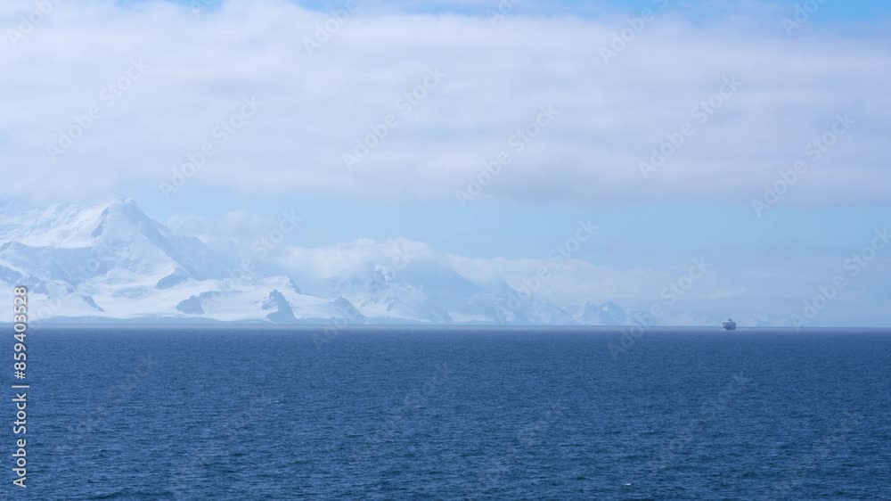 Antarctica Cruise Expedition Ship Travel Sailing in the Distance Wide Vista Ocean Snow Covered Mountains Blue Sky Clouds Antarctica Cruise Expedition Ship Travel Sailing in the Distance Wide Vista Ocean Snow Covered Mountains Blue Sky Clouds