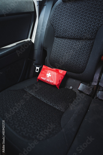 A small compact first aid kit is in the back seat of the car. © Aleksey