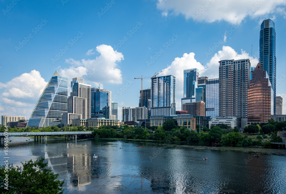 Modern apartment buildings and offices by the Colorado River in cityscape skyline of Austin Texas Modern apartment buildings and offices by the Colorado River in cityscape skyline of Austin Texas