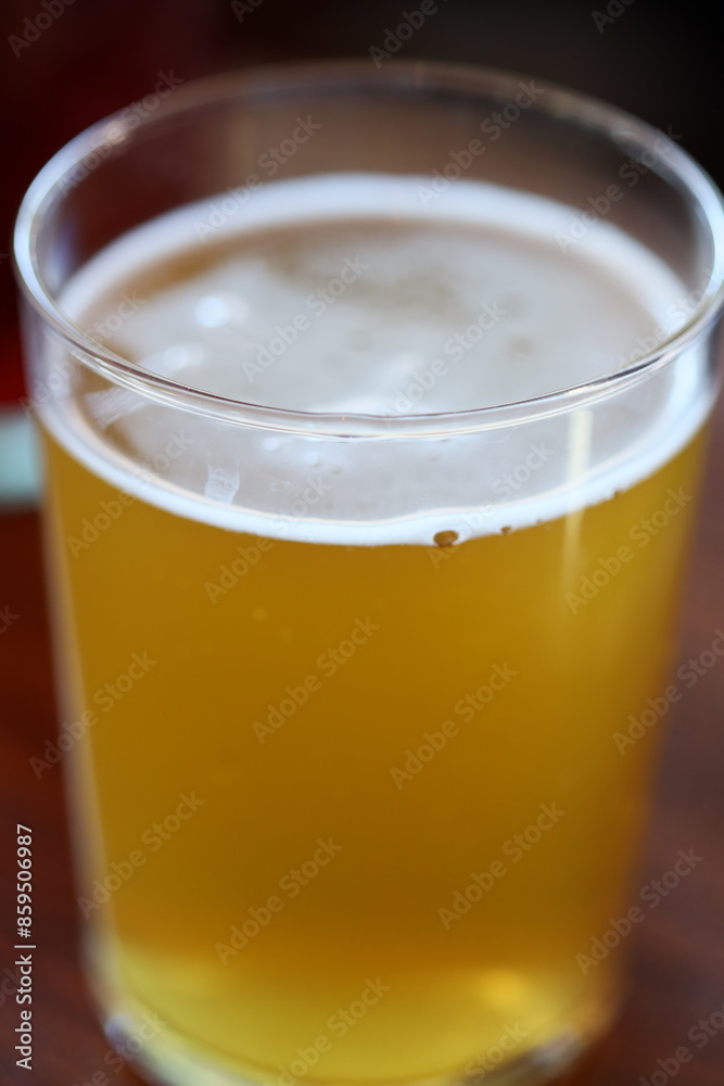 A single glass of freshly squeezed orange juice sitting on a table, great for breakfast or a snack A single glass of freshly squeezed orange juice sitting on a table, great for breakfast or a snack