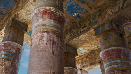 Hieroglypic carvings and paintings on columns in the ancient Egyptian Karnak Temple in Luxor