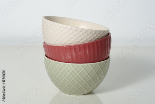Modern kitchen supplies, red, green, and beige bowls