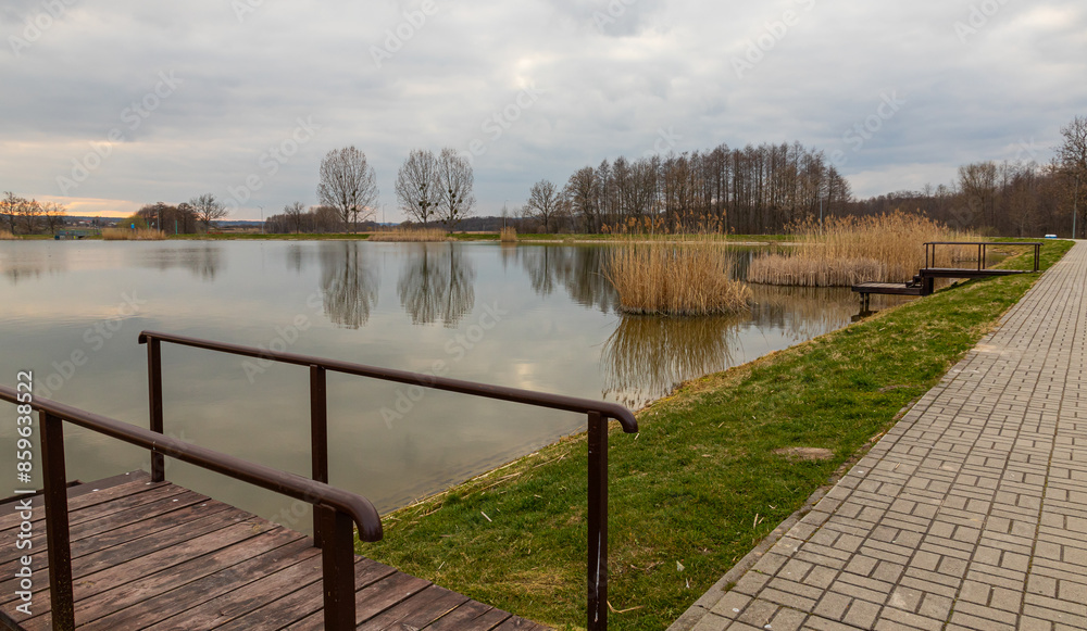 Naklejka premium Landscape in the countryside by the lake. A quiet place to relax by the water.