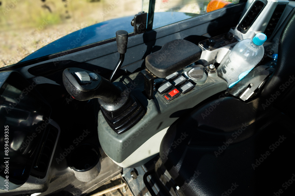 Fototapeta premium Controls of a small excavator in the cab. Background for special equipment theme concept