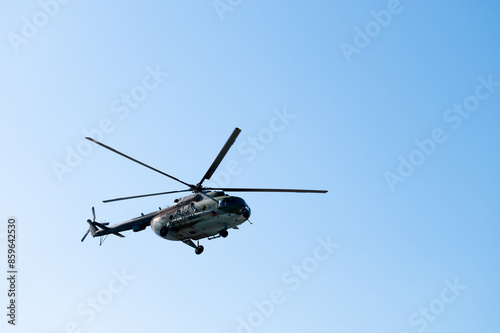 Wallpaper Mural Military large aircraft flies over a clear blue sky, close-up Torontodigital.ca
