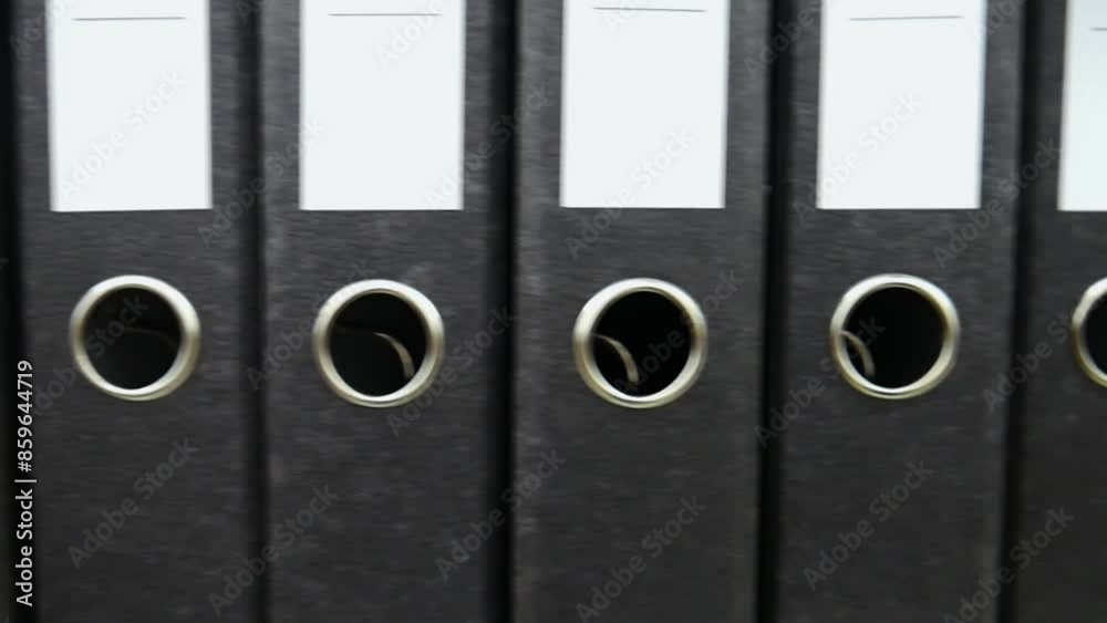 Close-up of many black archive folders