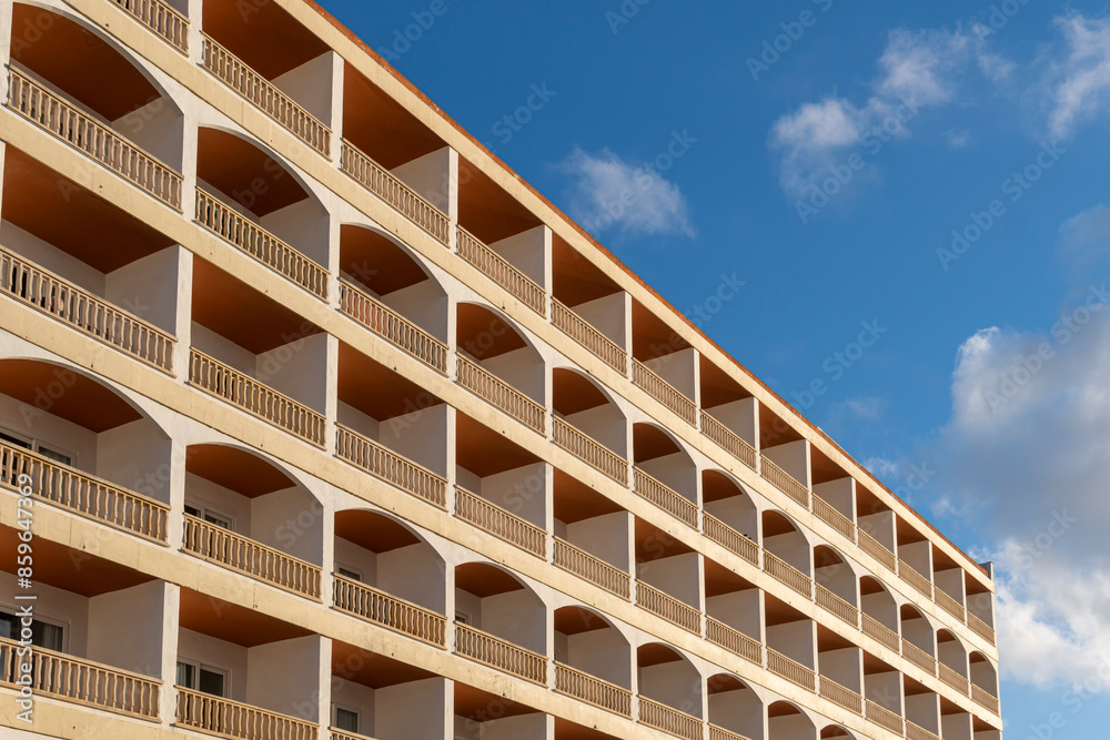 Facade with balconies of a hotel in a tourist area of the island of Mallorca at sunset. Spain Facade with balconies of a hotel in a tourist area of the island of Mallorca at sunset. Spain