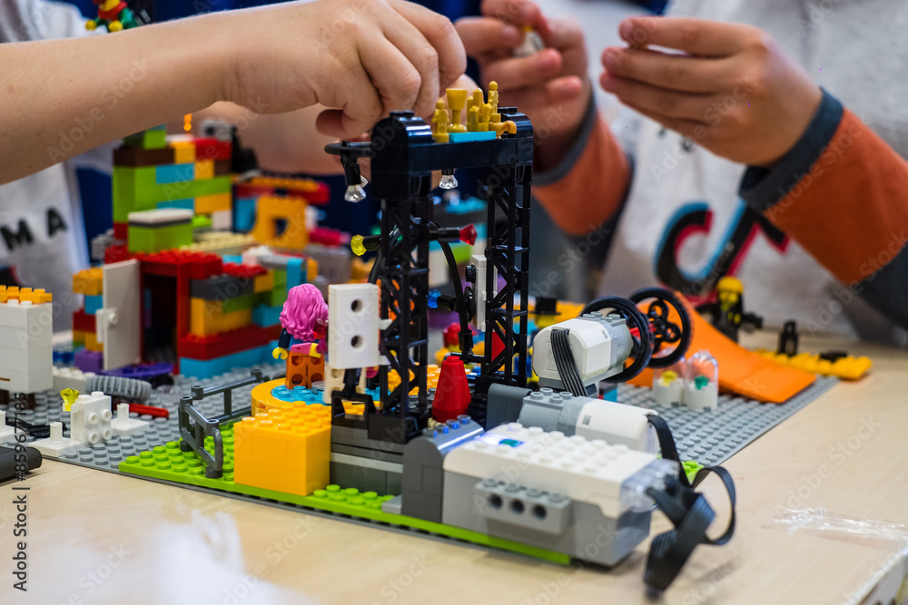 Fototapeta premium Tallinn, Estonia - May 5, 2024: Moving Lego robot built by kids. At First Lego League children build robots and solve robotics challenges.