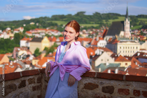 portrait of red head girl enjoy the view on Cesky Krumlov photo