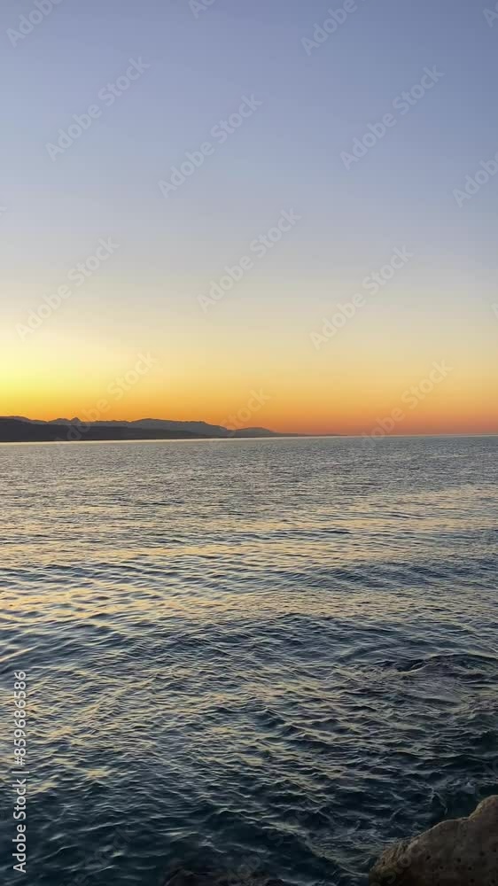 Sunrise over the beach and city in Malaga, Spain Sunrise over the beach and city in Malaga, Spain
