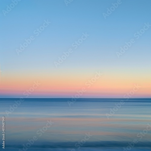 A beautiful blue ocean with a pink and orange sky in the background © PuiZera