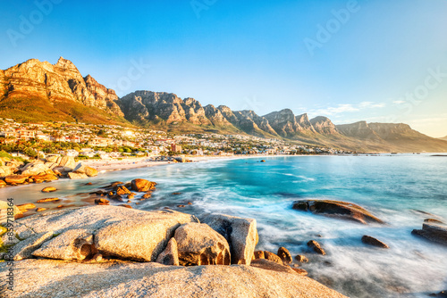 Cape Town Sunset over Camps Bay Beach with Table Mountain and Twelve Apostles in the Background